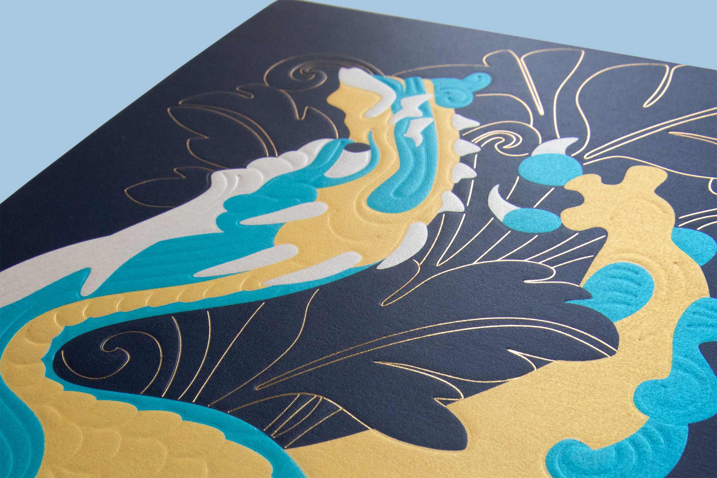 Close-up photo of the embossed illustration on the front cover